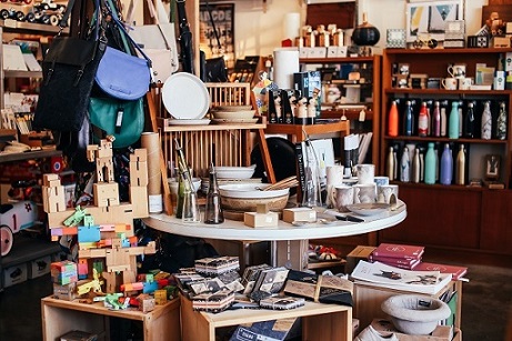Stores Play an Important Role in Driving Registry Activity - Leverage their unique features to complement your online business. Table with various goods in shop