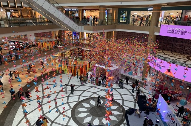 A Retail and Registry Restart, a huge shopping mall with decorations and confetti everywhere.