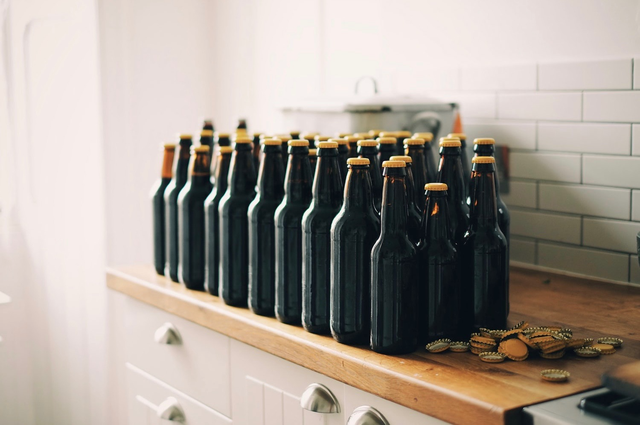 14 of the Best Wedding Registry Gifts for Beer Lovers, a bunch of beer bottles.