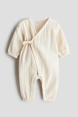 Light beige Cotton Muslin Romper Suit for kids | H&M US