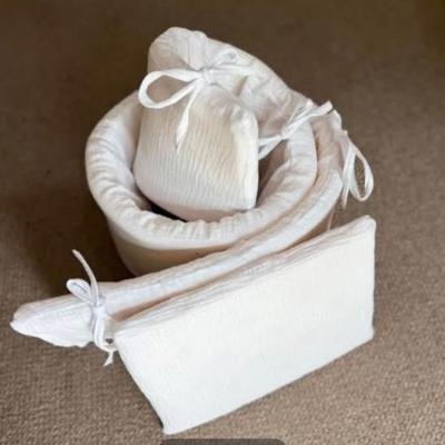 White Muslin bumper and pillow from Bronwen Dehrmann on WhatsApp.