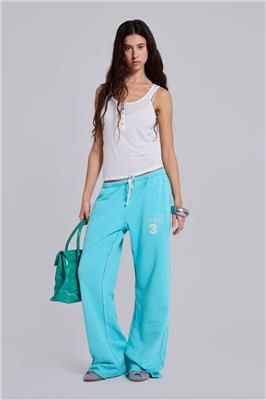 Cleo Slouchy Bootcut Jogger in Turquoise | Jaded London