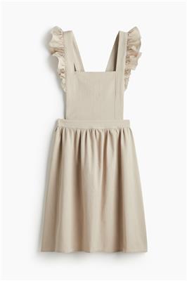 Light mole Flounce-trimmed apron | H&M Home