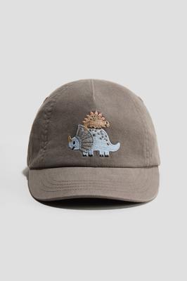 Mole/Dinosaurs Cotton cap for kids | H&M GB